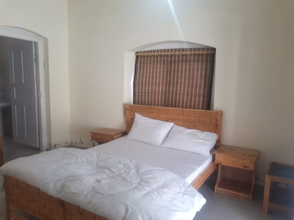 Standard Rooms are furnished with local wooden carved furniture.  Hot water are available 24 hrs. Secured parking available. Electricity provided by solar system.